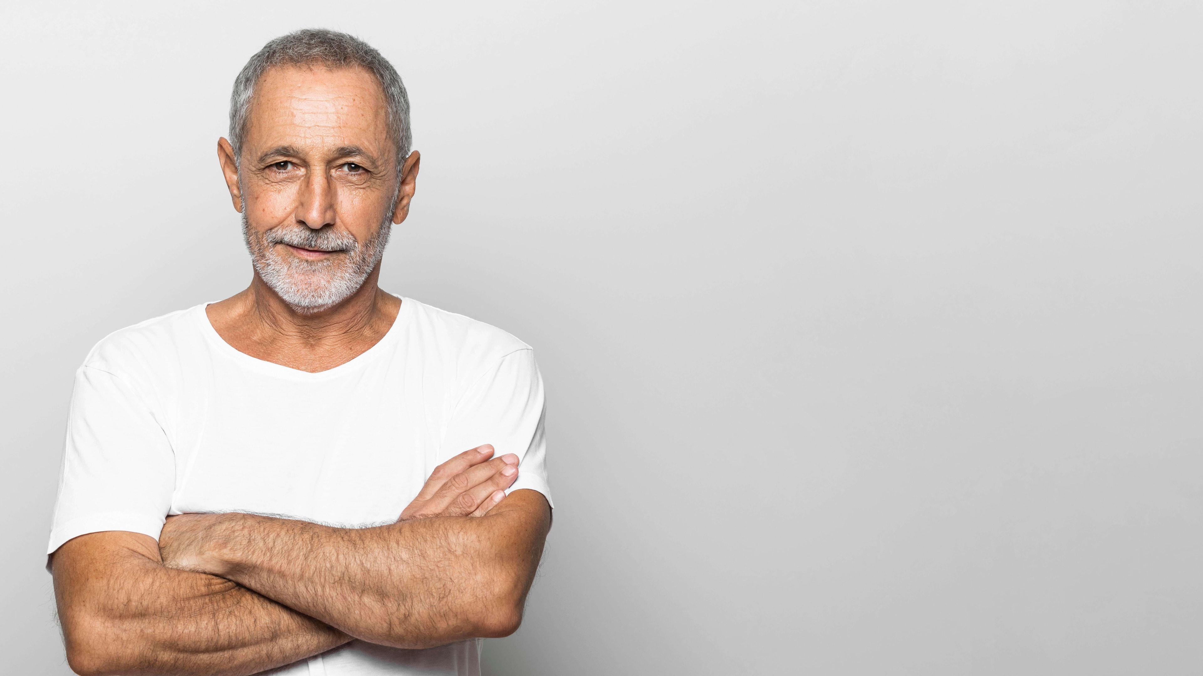 medium-shot-senior-man-with-crossed-arms-2.jpg